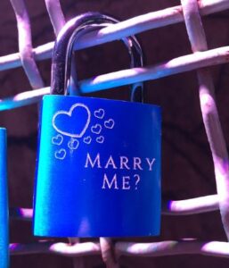 love lock on wall with marry me? engraved