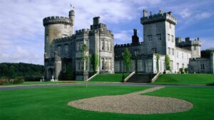 beautiful Dromoland castle in irland with green grass and golf course